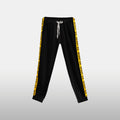 Desert Ice Yellow Stripe Joggers "Black" (Unisex) بنطال رياضي مخطط باللون الأصفر "أسود" (للجنسين)